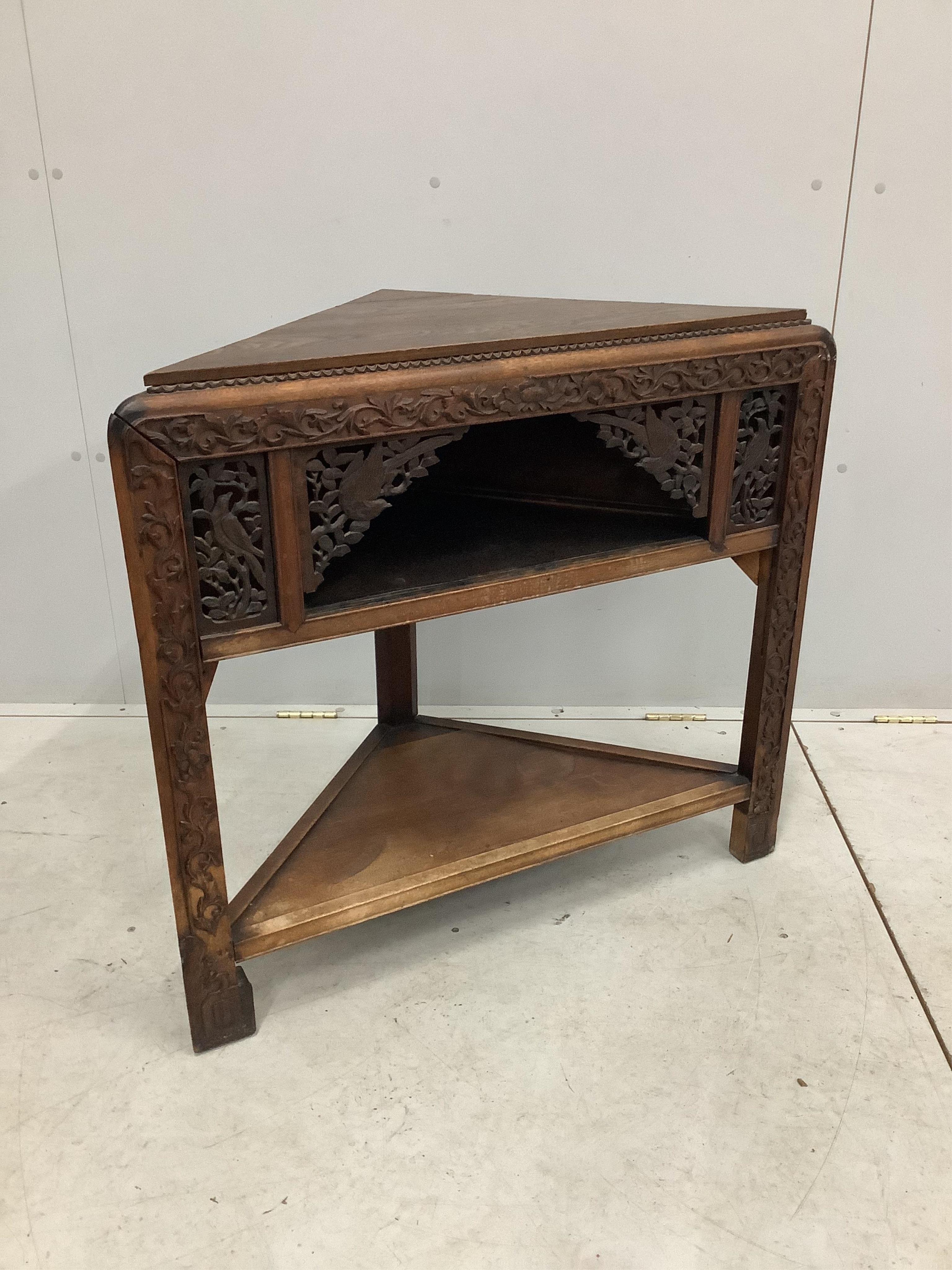 An early 20th century Chinese corner fitting table with later oak top, width 85cm, height 79cm. Condition - fair